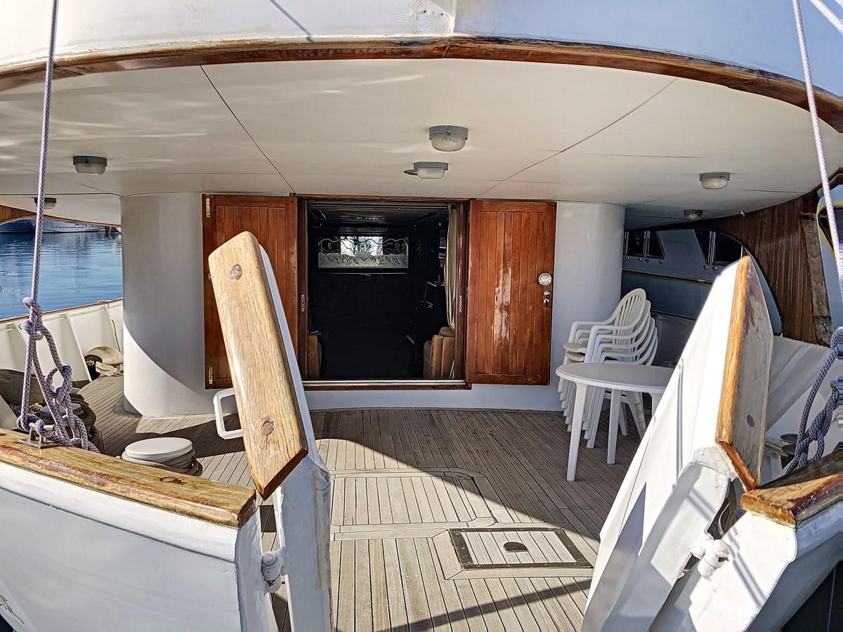 a boat with a wood deck aboard ELIKI Yacht for Sale