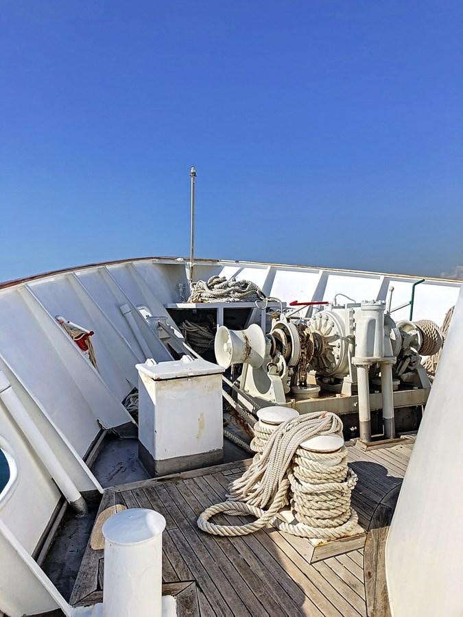a large white machine with a large pipe coming out of it aboard ELIKI Yacht for Sale