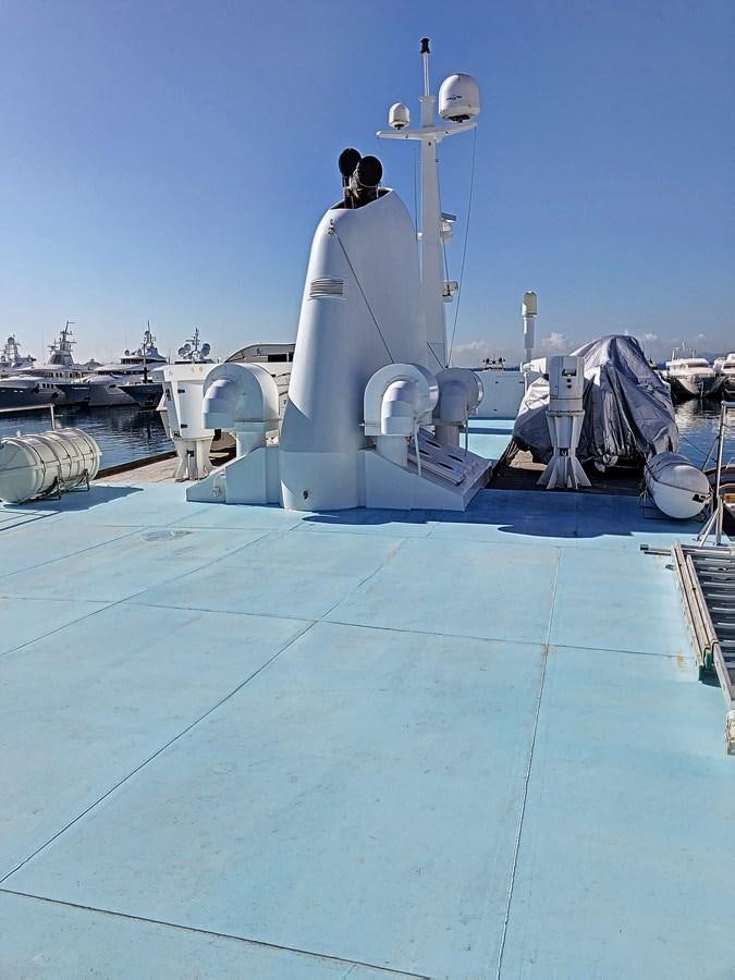 a large white boat with a statue on it aboard ELIKI Yacht for Sale
