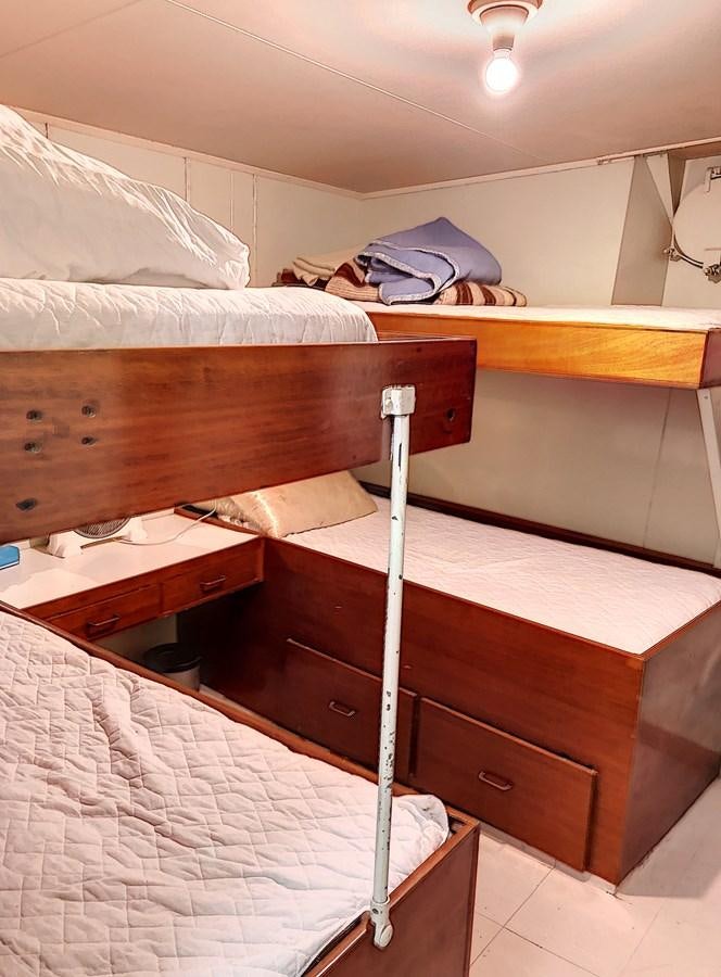 a couple of beds in a hotel room aboard ELIKI Yacht for Sale