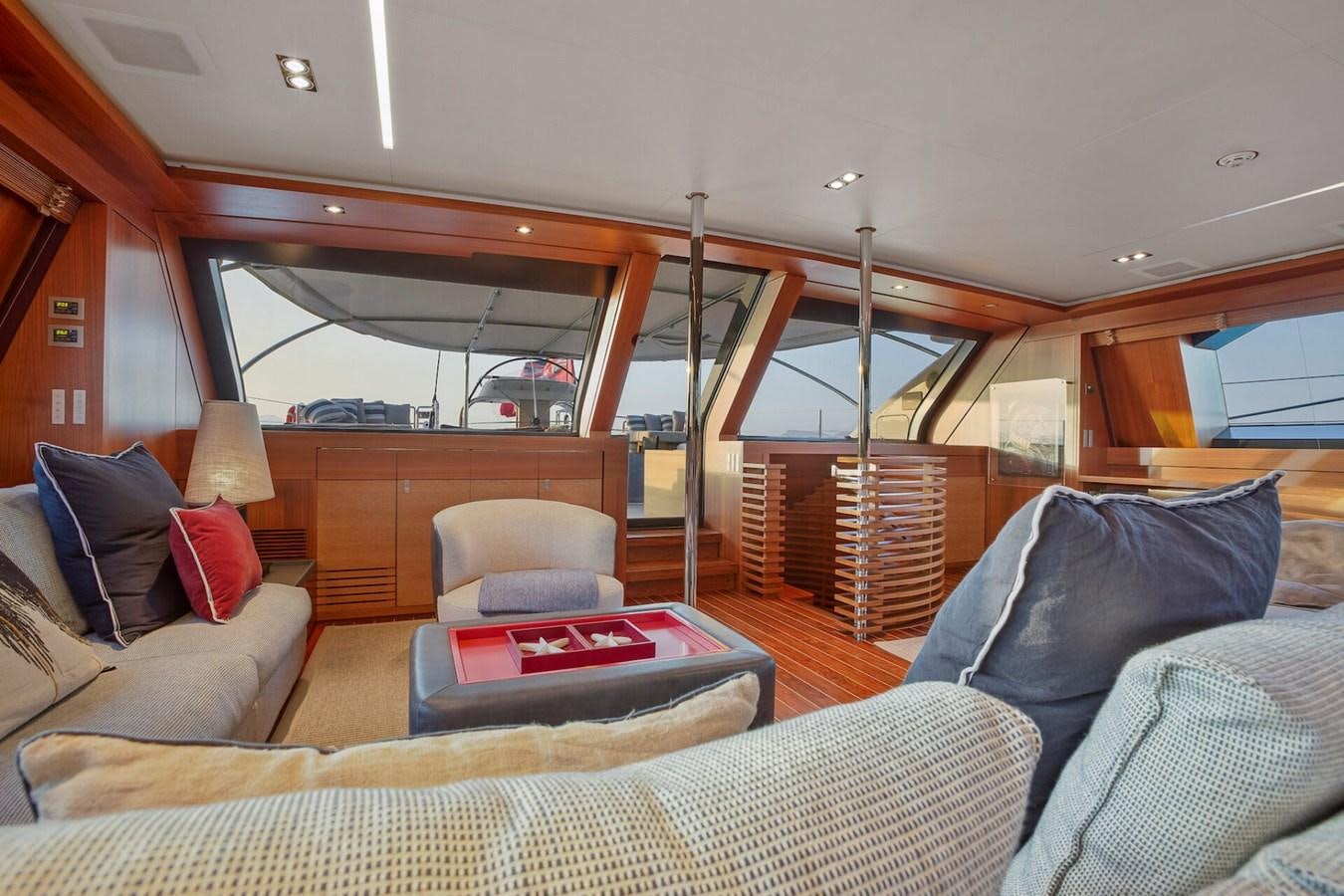 a boat with a couch and a table in it aboard STATE OF GRACE Yacht for Sale