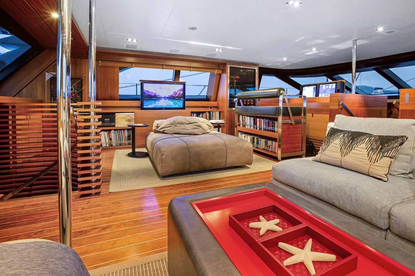 a living room with a large glass door aboard STATE OF GRACE Yacht for Sale