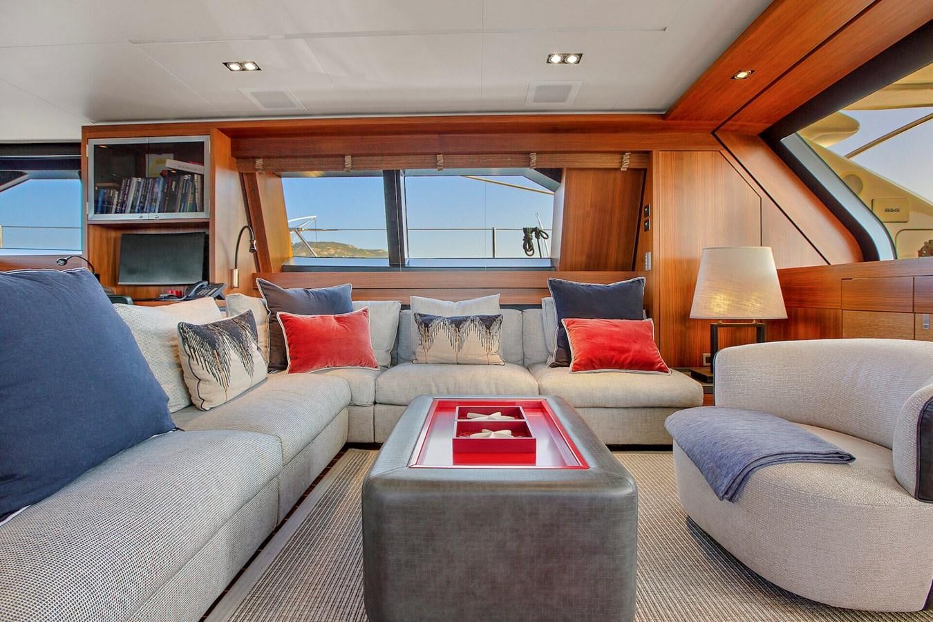 a living room with a couch and a coffee table aboard STATE OF GRACE Yacht for Sale