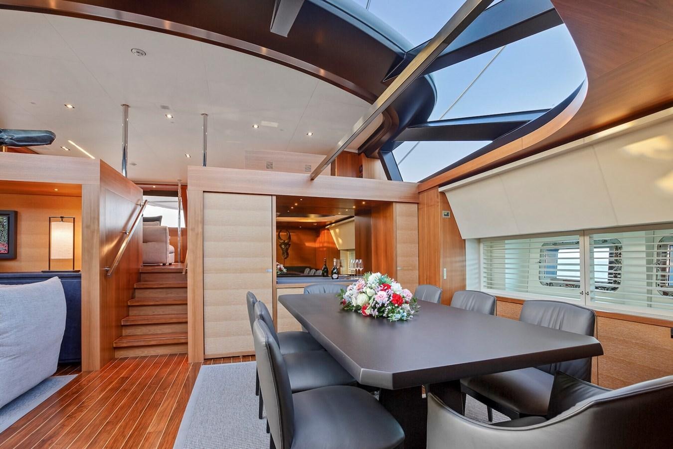 a room with a table and chairs aboard STATE OF GRACE Yacht for Sale
