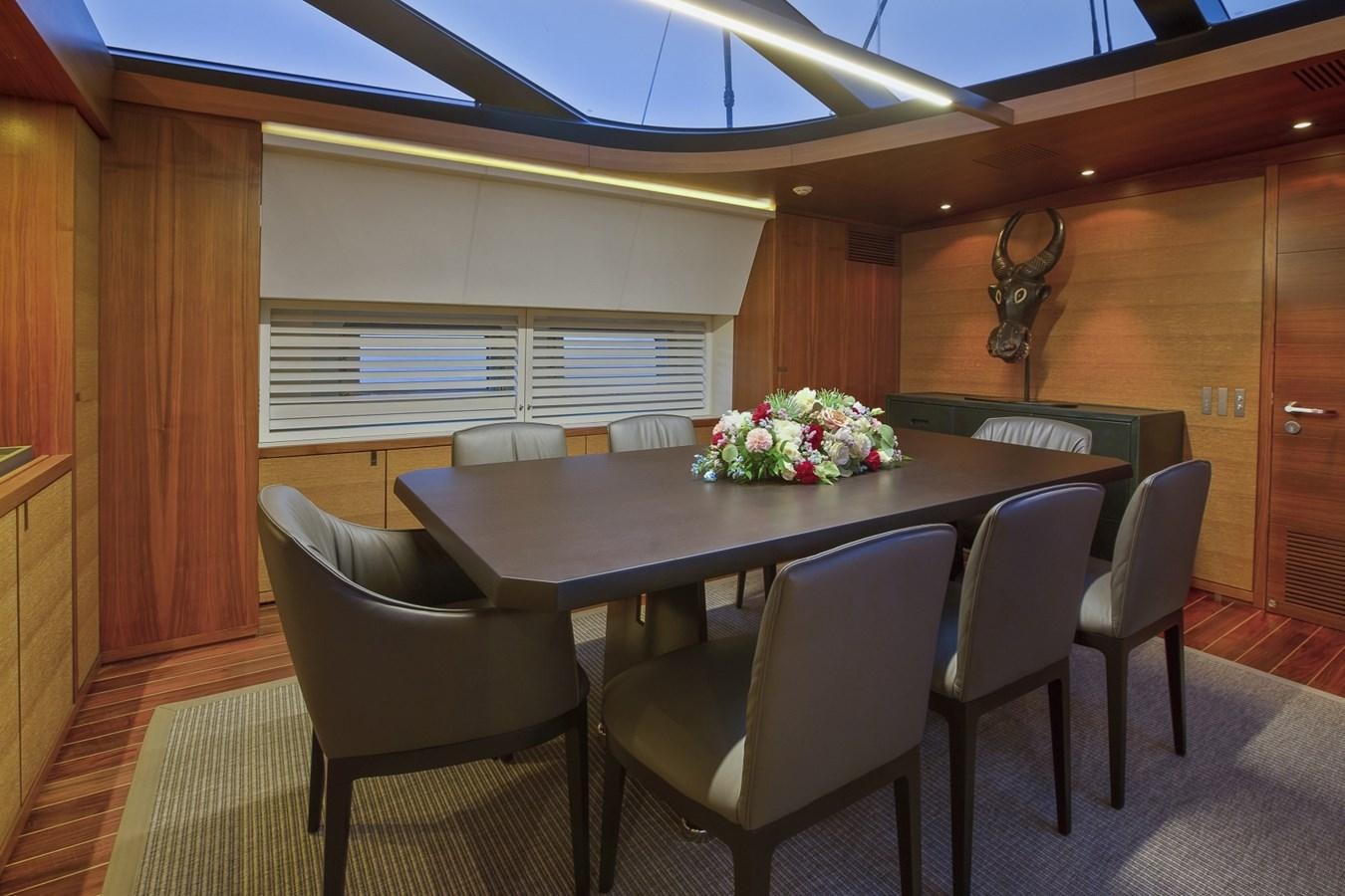 a table with chairs around it aboard STATE OF GRACE Yacht for Sale