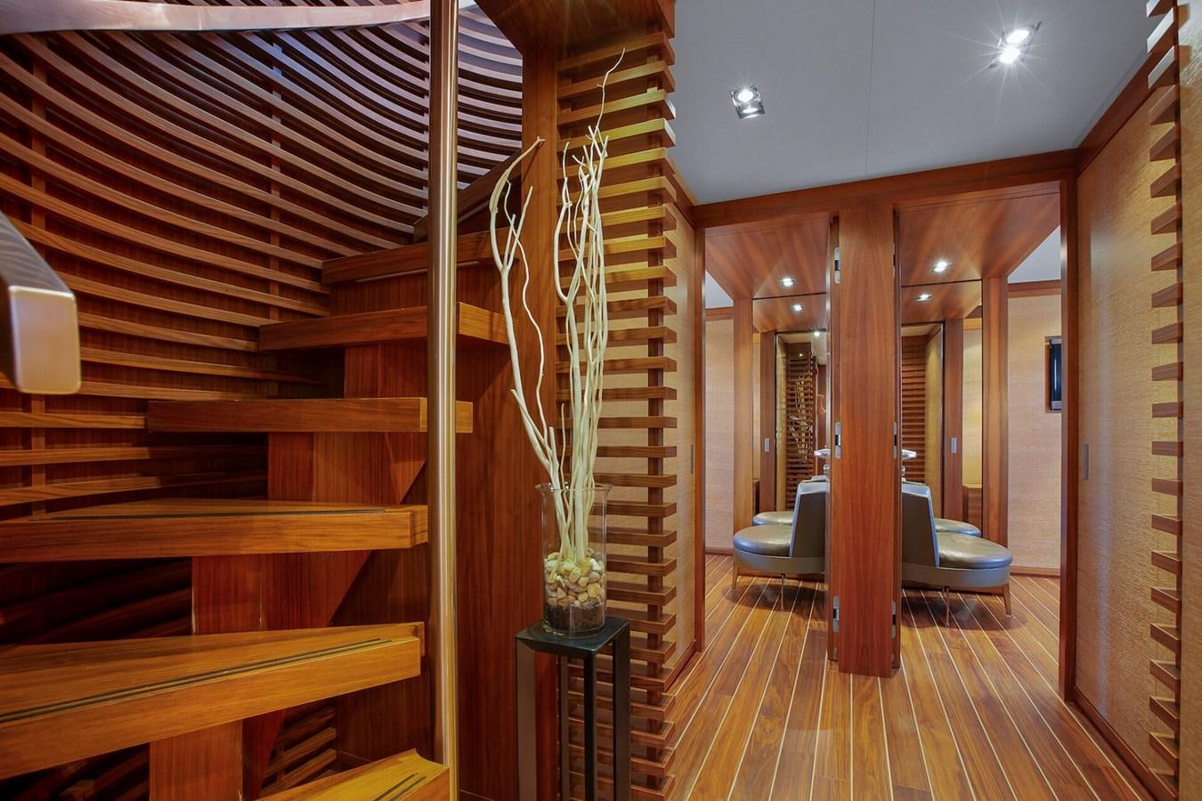 a room with a wood floor and a wood staircase aboard STATE OF GRACE Yacht for Sale
