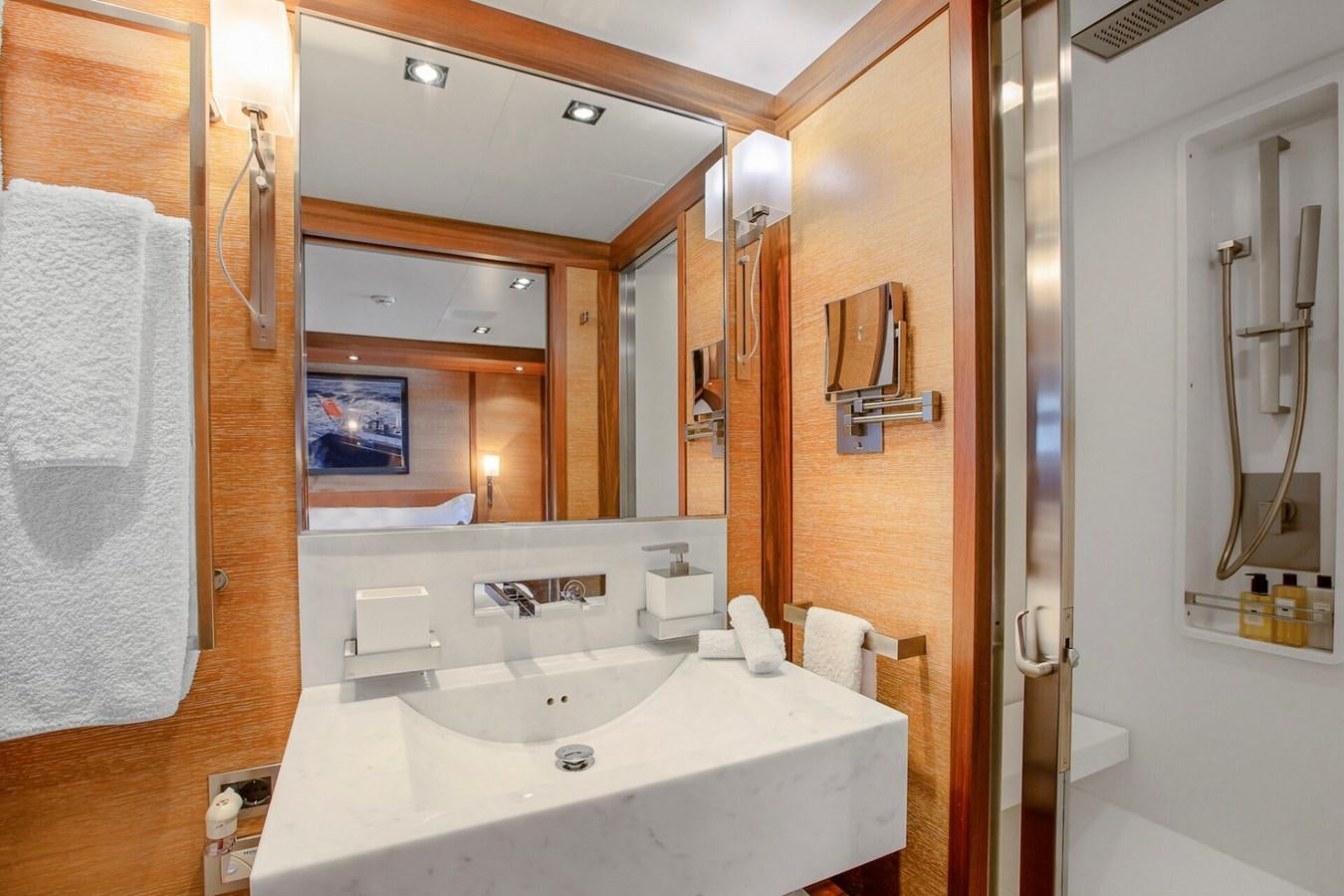 a bathroom with a sink and a mirror aboard STATE OF GRACE Yacht for Sale