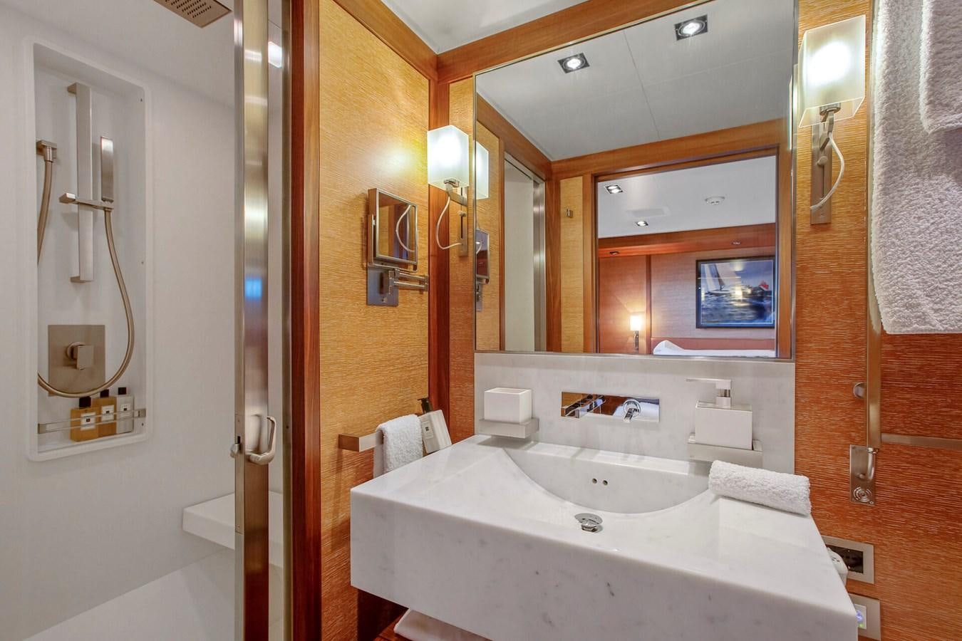 a bathroom with a sink and a mirror aboard STATE OF GRACE Yacht for Sale