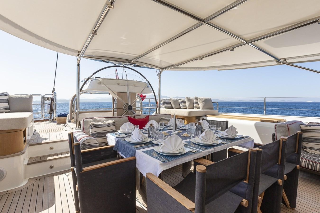 a boat with a table and chairs aboard STATE OF GRACE Yacht for Sale
