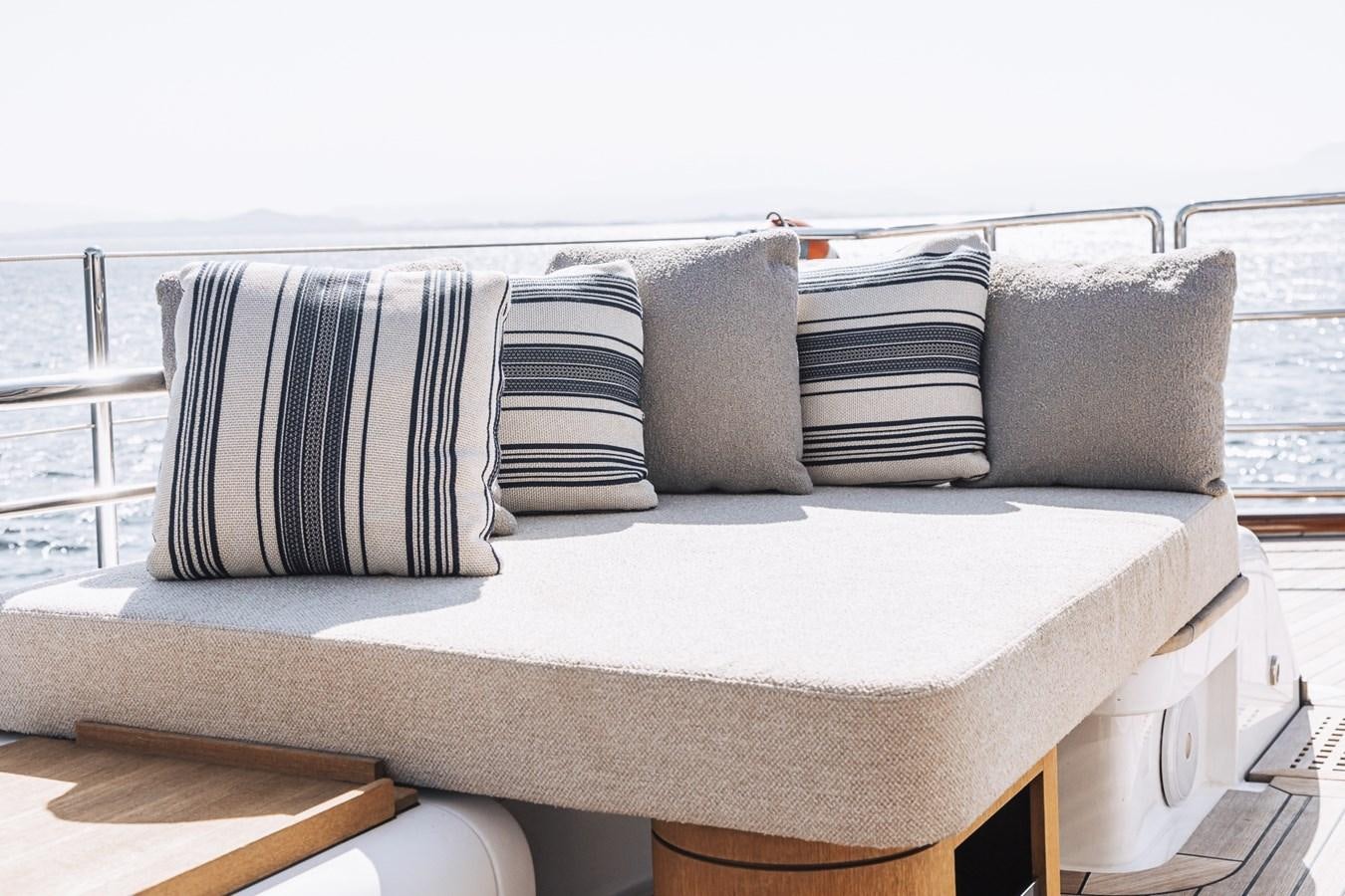 a white couch with pillows aboard STATE OF GRACE Yacht for Sale
