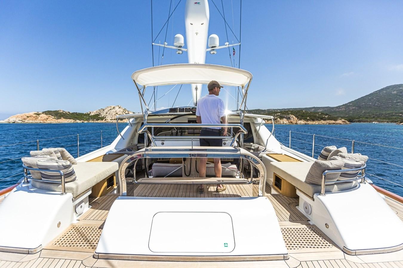 a person standing on a boat aboard STATE OF GRACE Yacht for Sale