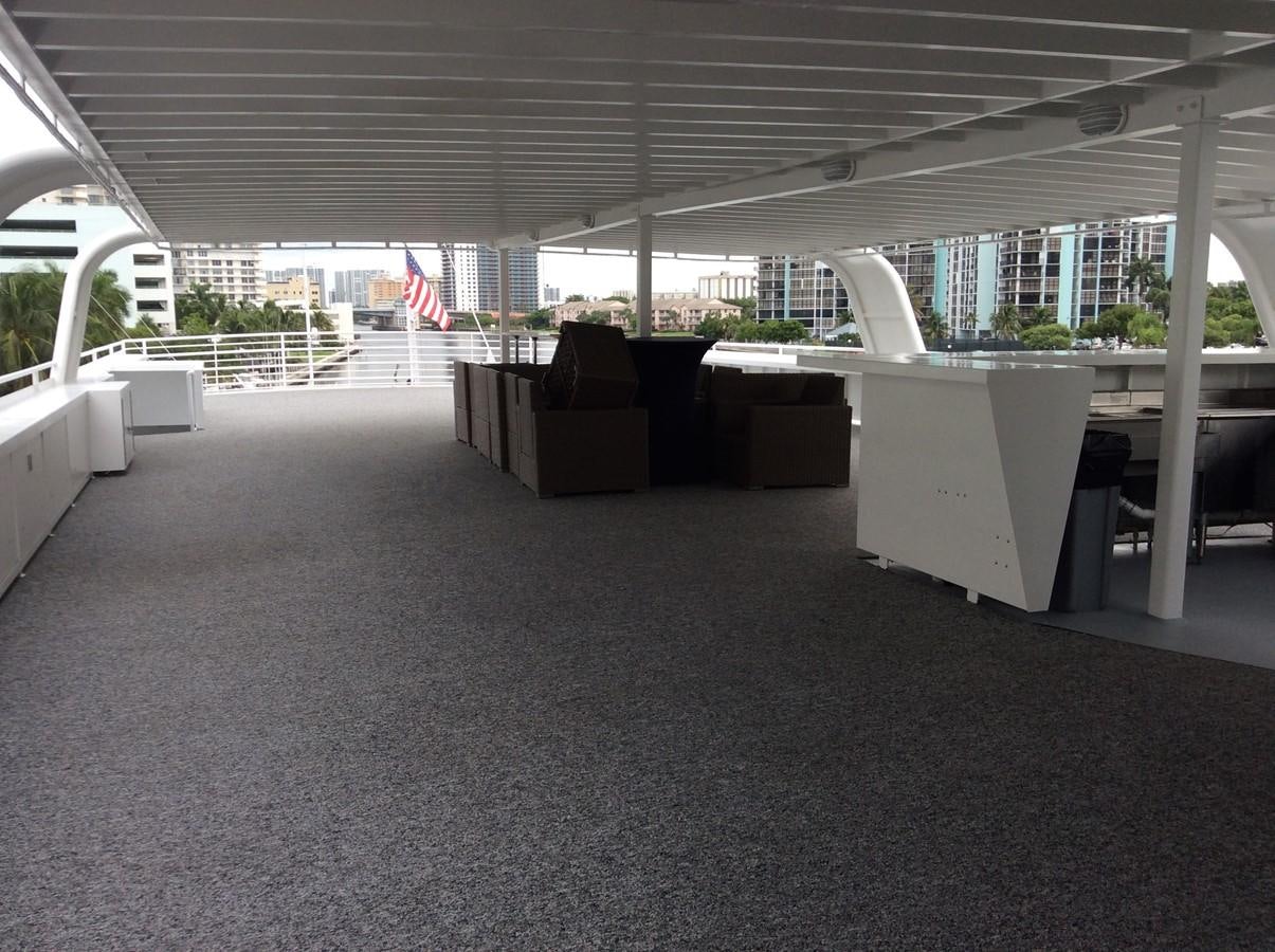 a large room with tables and chairs aboard SIR WINSTON Yacht for Sale