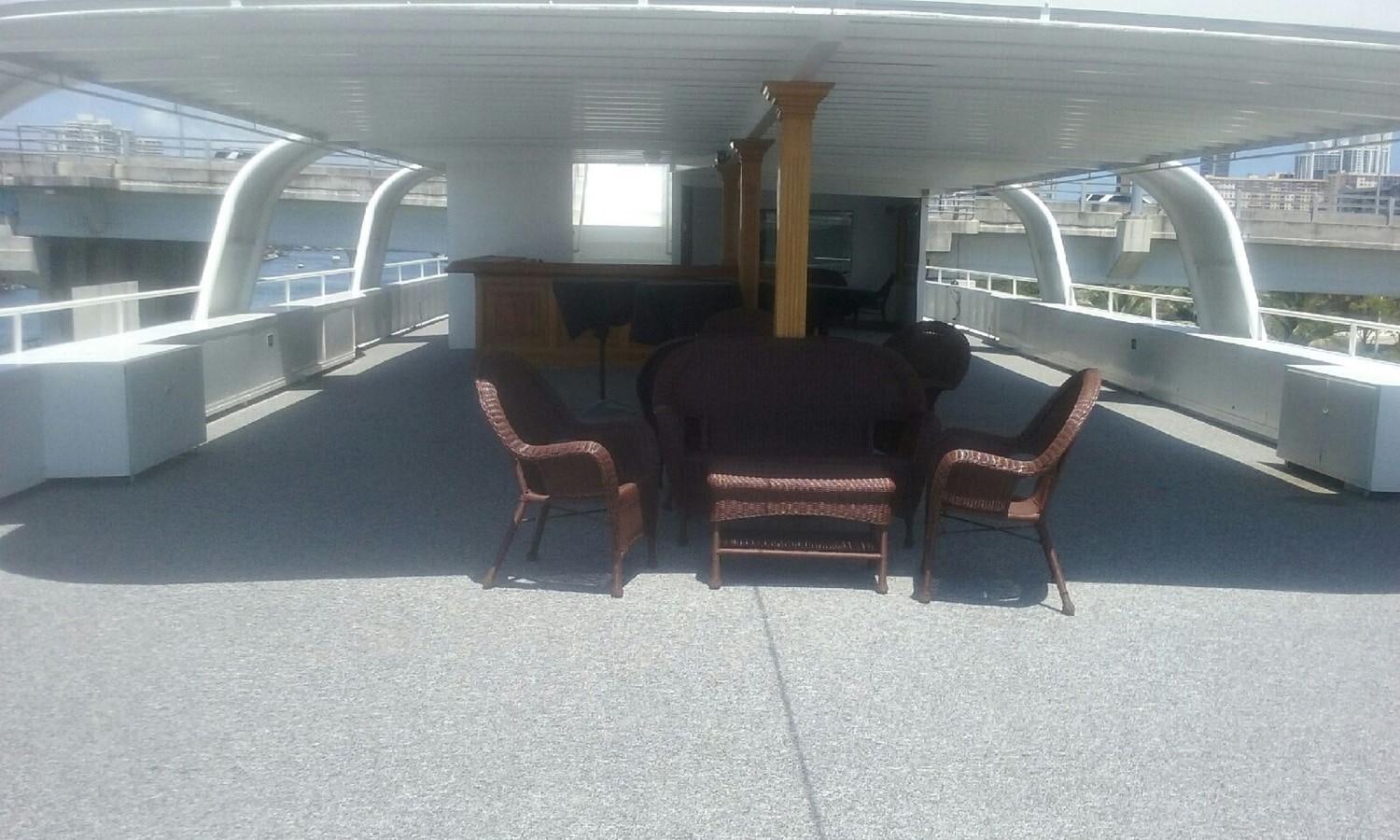 a room with chairs and a staircase aboard SIR WINSTON Yacht for Sale