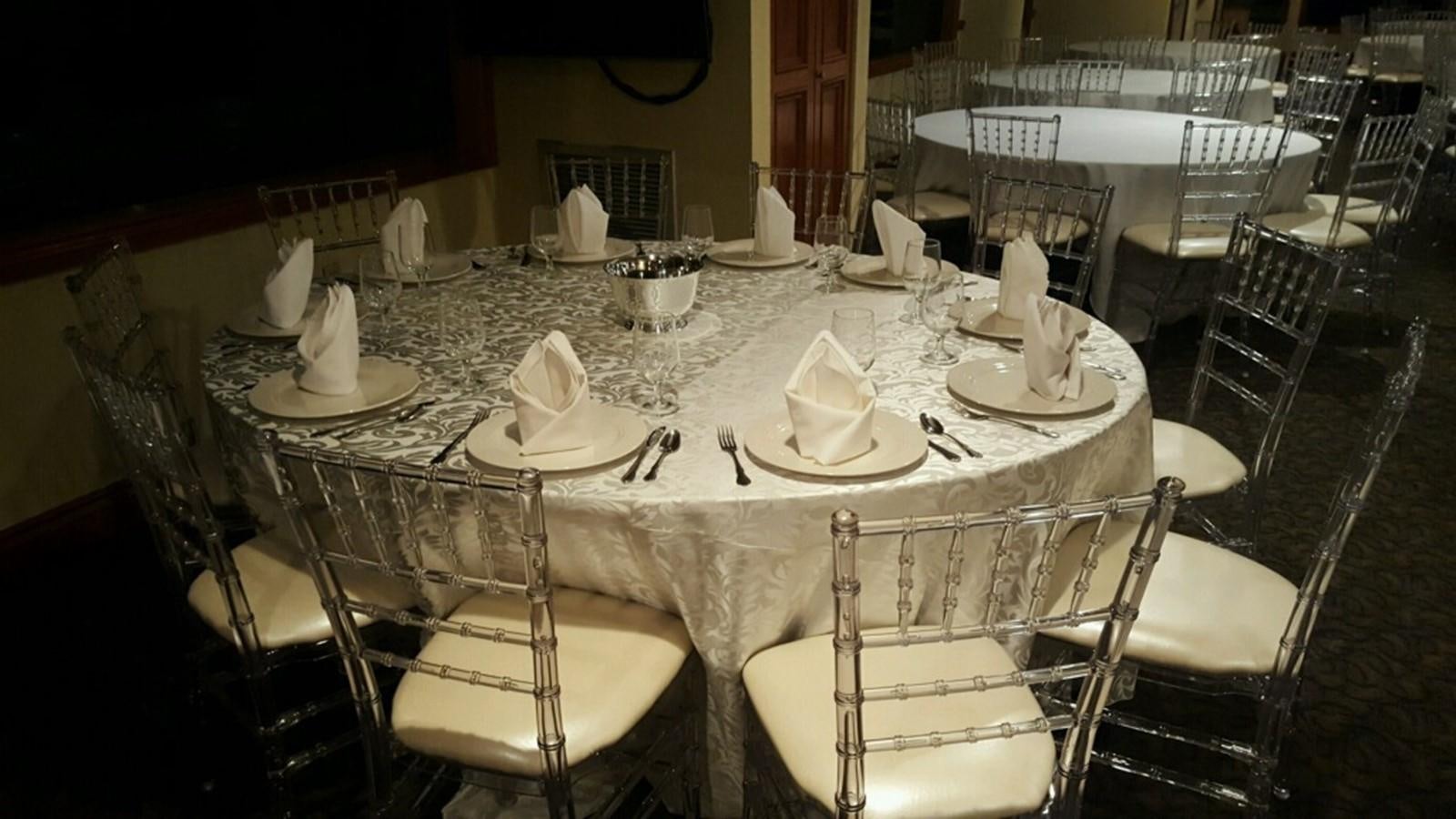 a table set with plates and napkins aboard SIR WINSTON Yacht for Sale