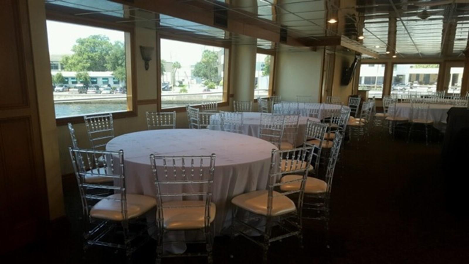 a table set up for a meal aboard SIR WINSTON Yacht for Sale