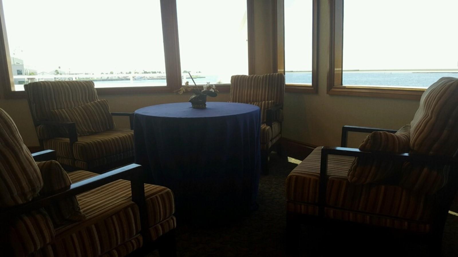 a room with a table and chairs aboard SIR WINSTON Yacht for Sale