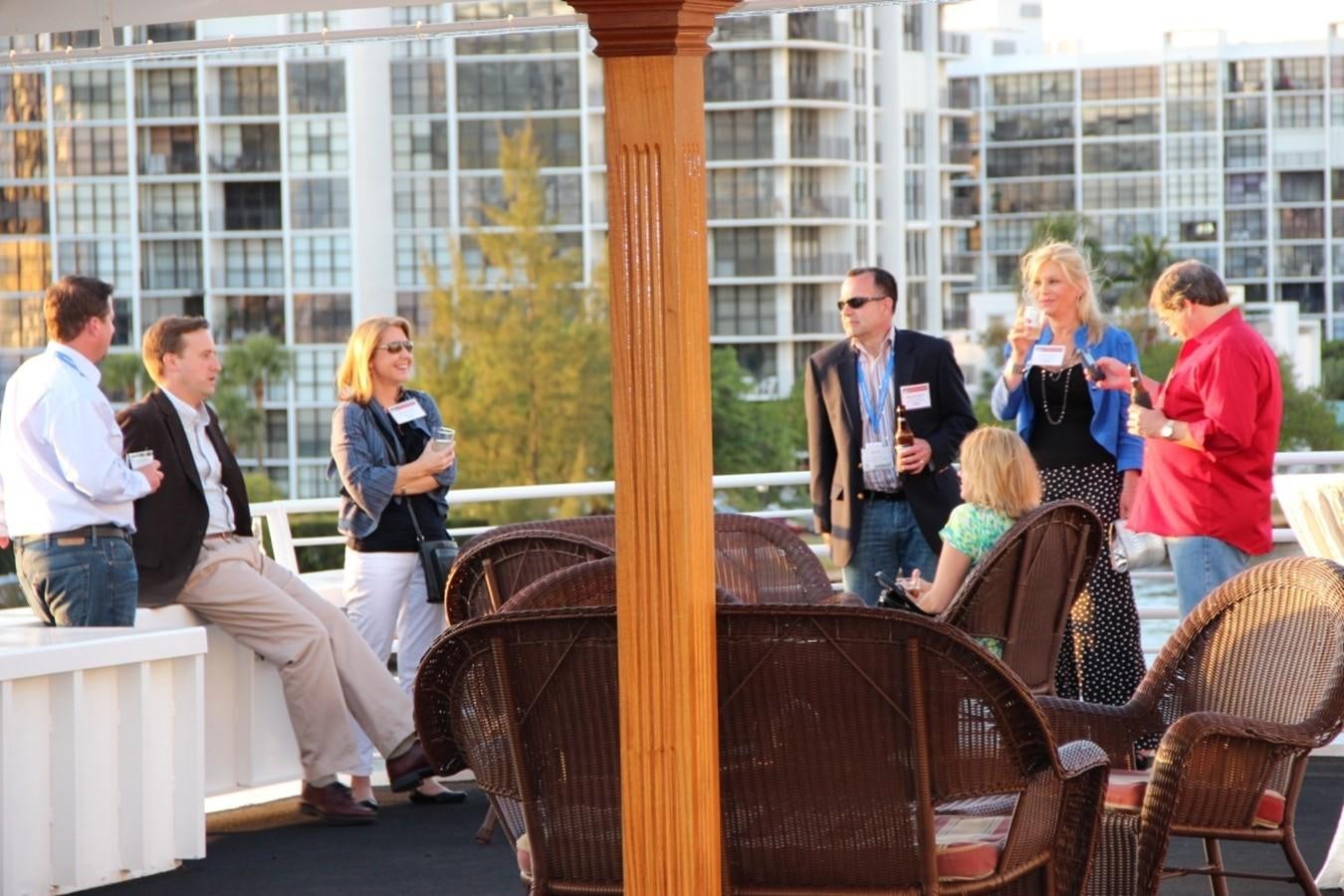 people standing around a table aboard SIR WINSTON Yacht for Sale