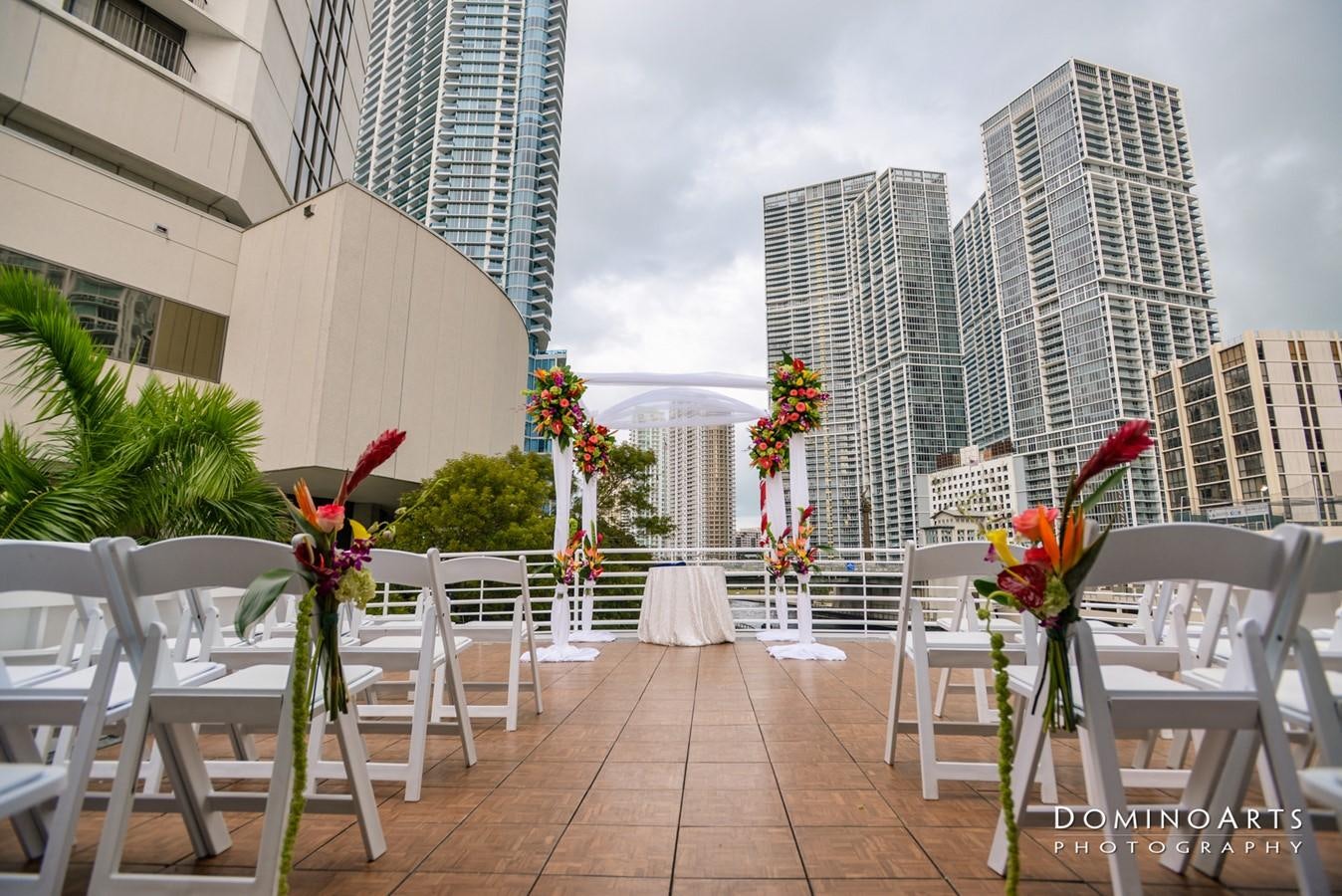 a patio with tables and chairs aboard SIR WINSTON Yacht for Sale