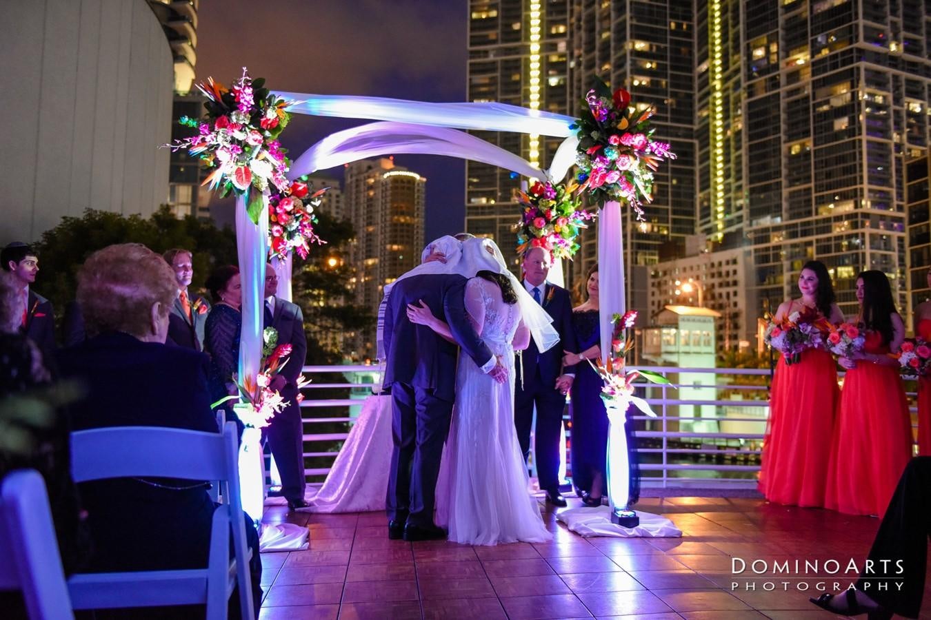 a group of people in a room with tables and chairs and a stage with lights aboard SIR WINSTON Yacht for Sale