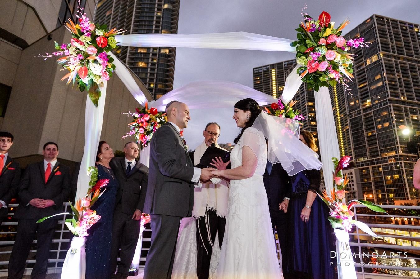 a bride and groom walking down the aisle aboard SIR WINSTON Yacht for Sale