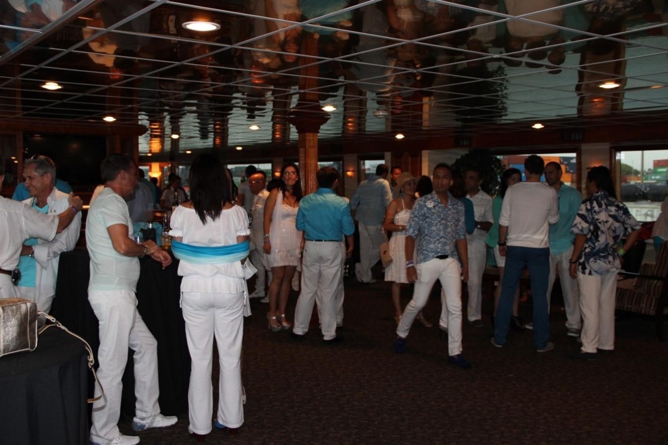 a group of people in a room aboard SIR WINSTON Yacht for Sale