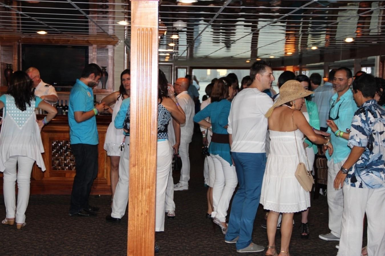 a group of people standing around a pole aboard SIR WINSTON Yacht for Sale