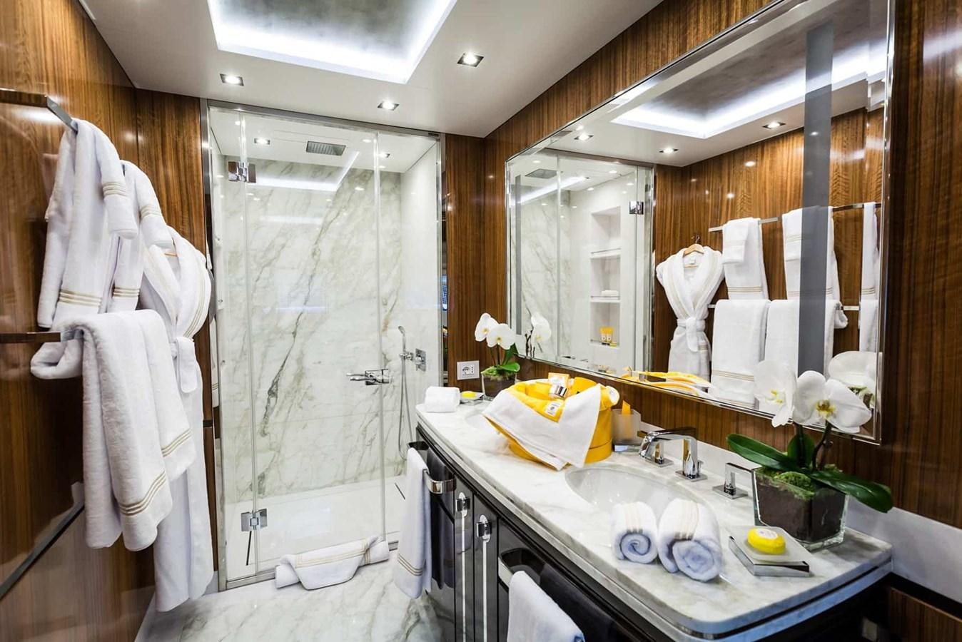 a bathroom with a sink and a shower aboard GTT 130 Yacht for Sale