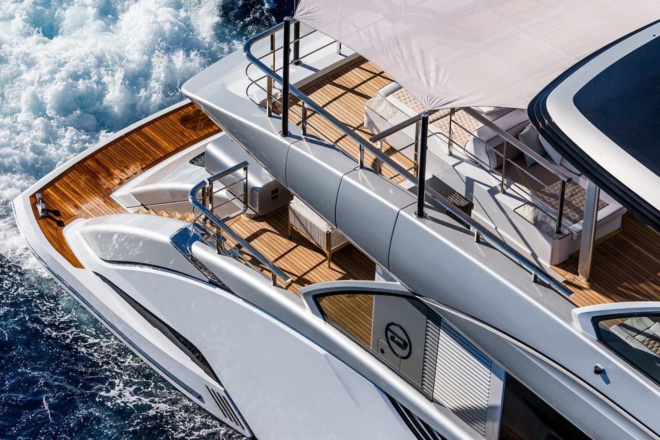 a white boat on the water aboard GTT 130 Yacht for Sale