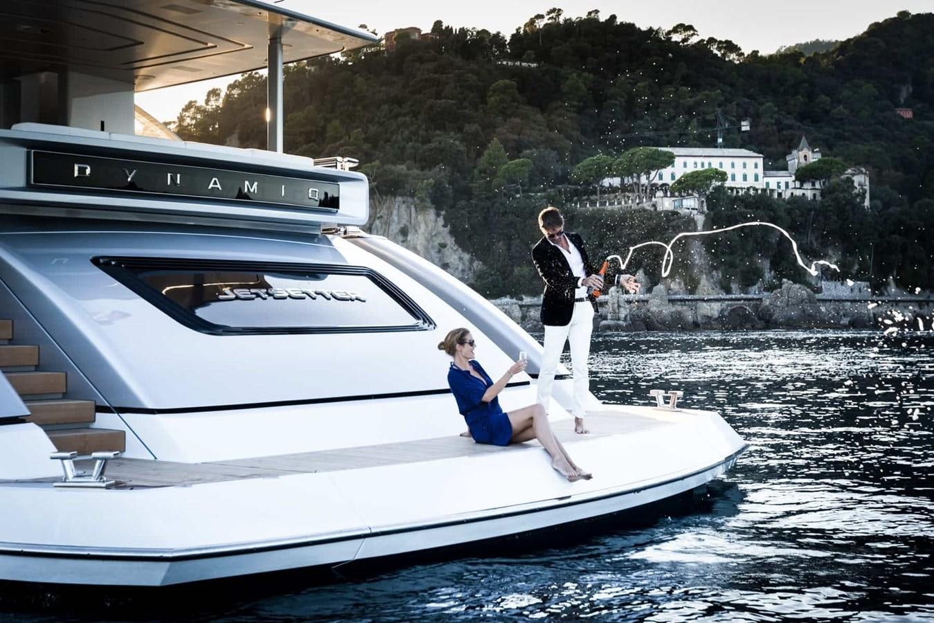 a group of people on a boat aboard GTT 130 Yacht for Sale