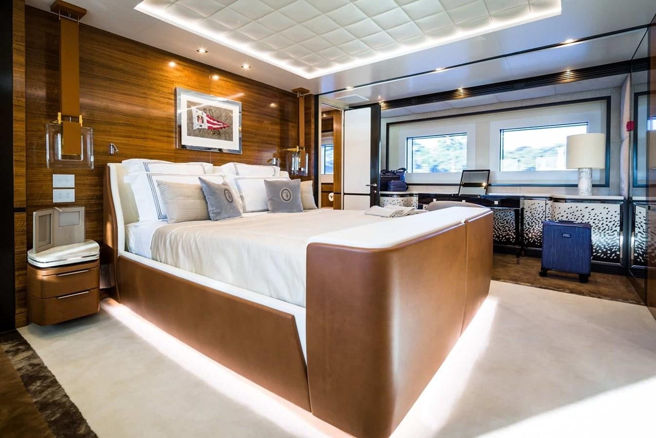 a large bedroom with a large bed aboard GTT 130 Yacht for Sale