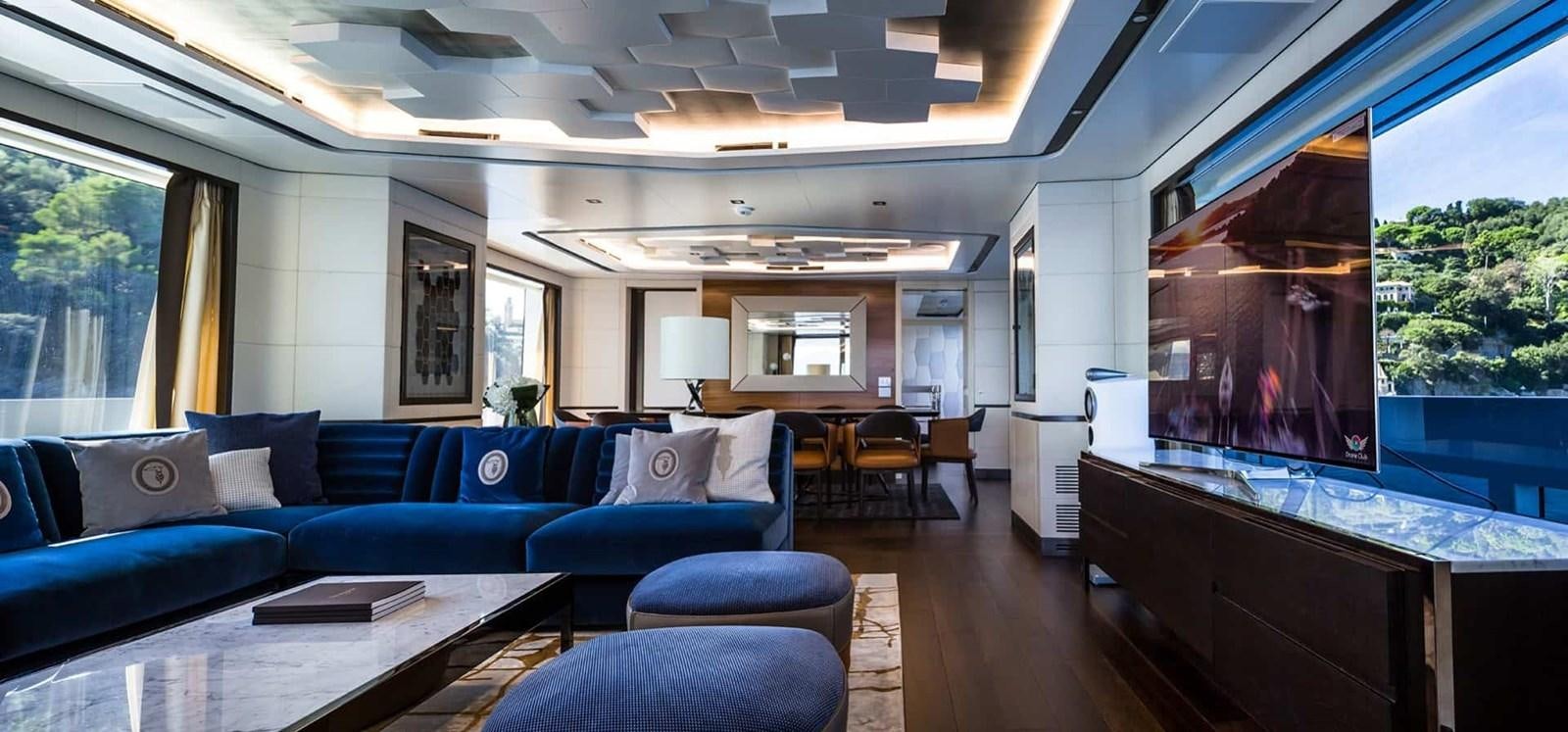 a living room with a large window aboard GTT 130 Yacht for Sale