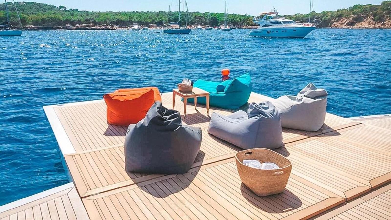 a group of boats on a dock aboard GTT 130 Yacht for Sale