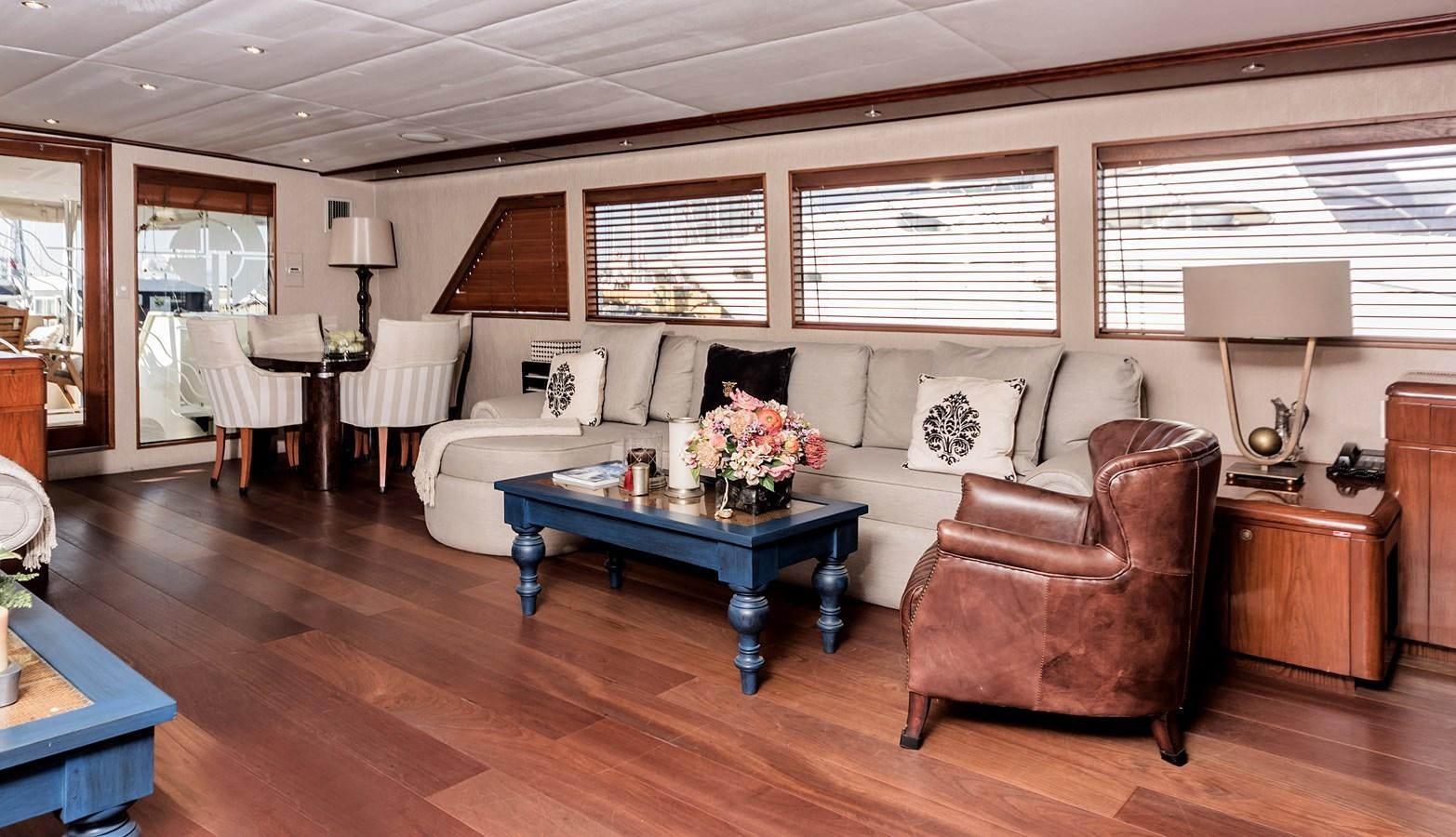 a living room with a couch and a table aboard SU Yacht for Sale