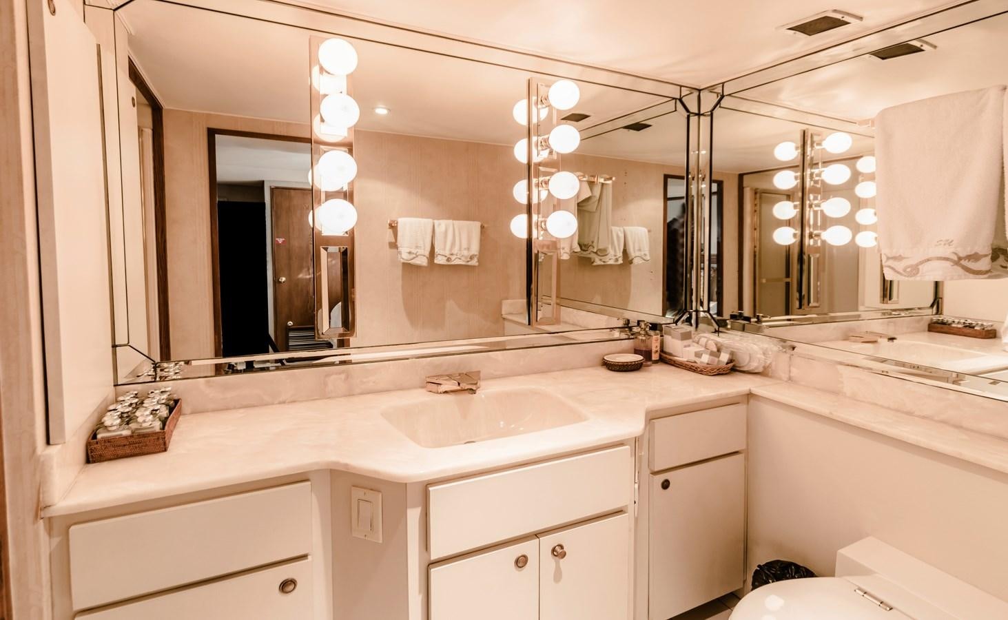 a bathroom with a large mirror aboard SU Yacht for Sale