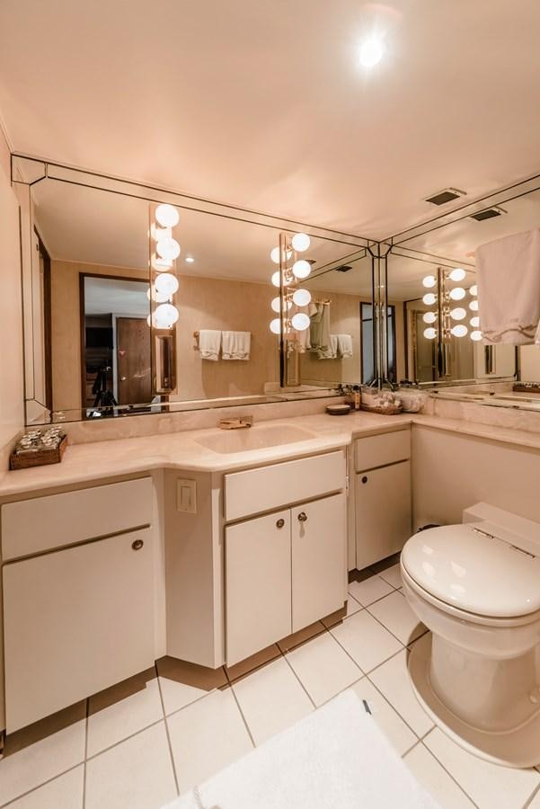 a bathroom with a large mirror aboard SU Yacht for Sale