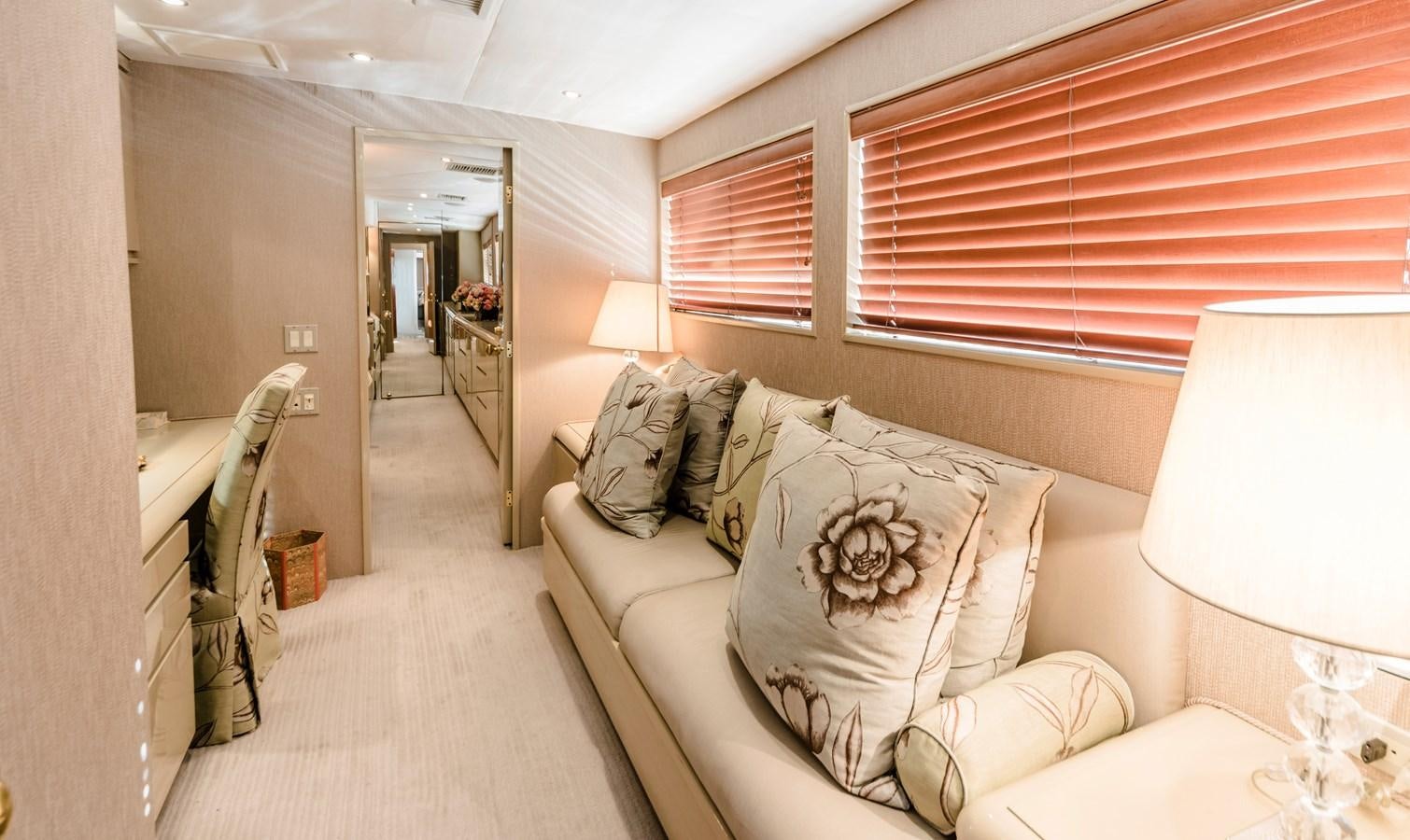 a bedroom with a bed and a mirror aboard SU Yacht for Sale
