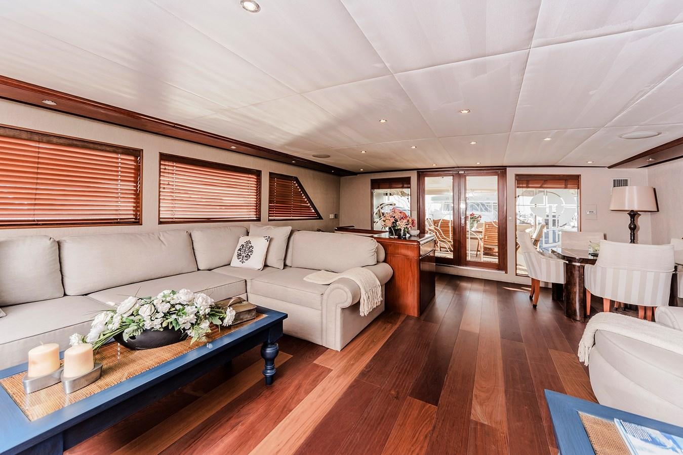 a living room with a couch and a table aboard SU Yacht for Sale