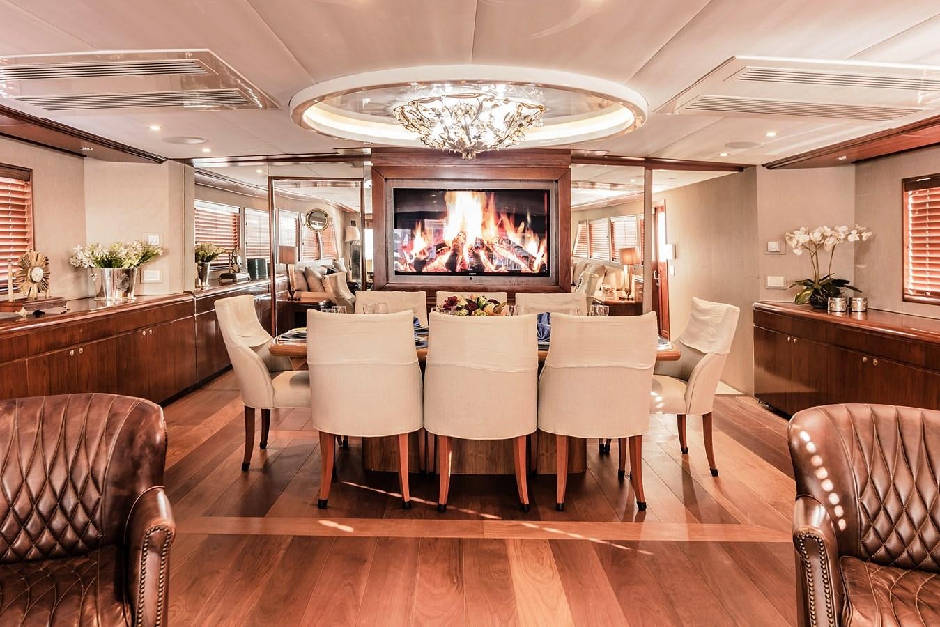 a large kitchen with a large chandelier aboard SU Yacht for Sale