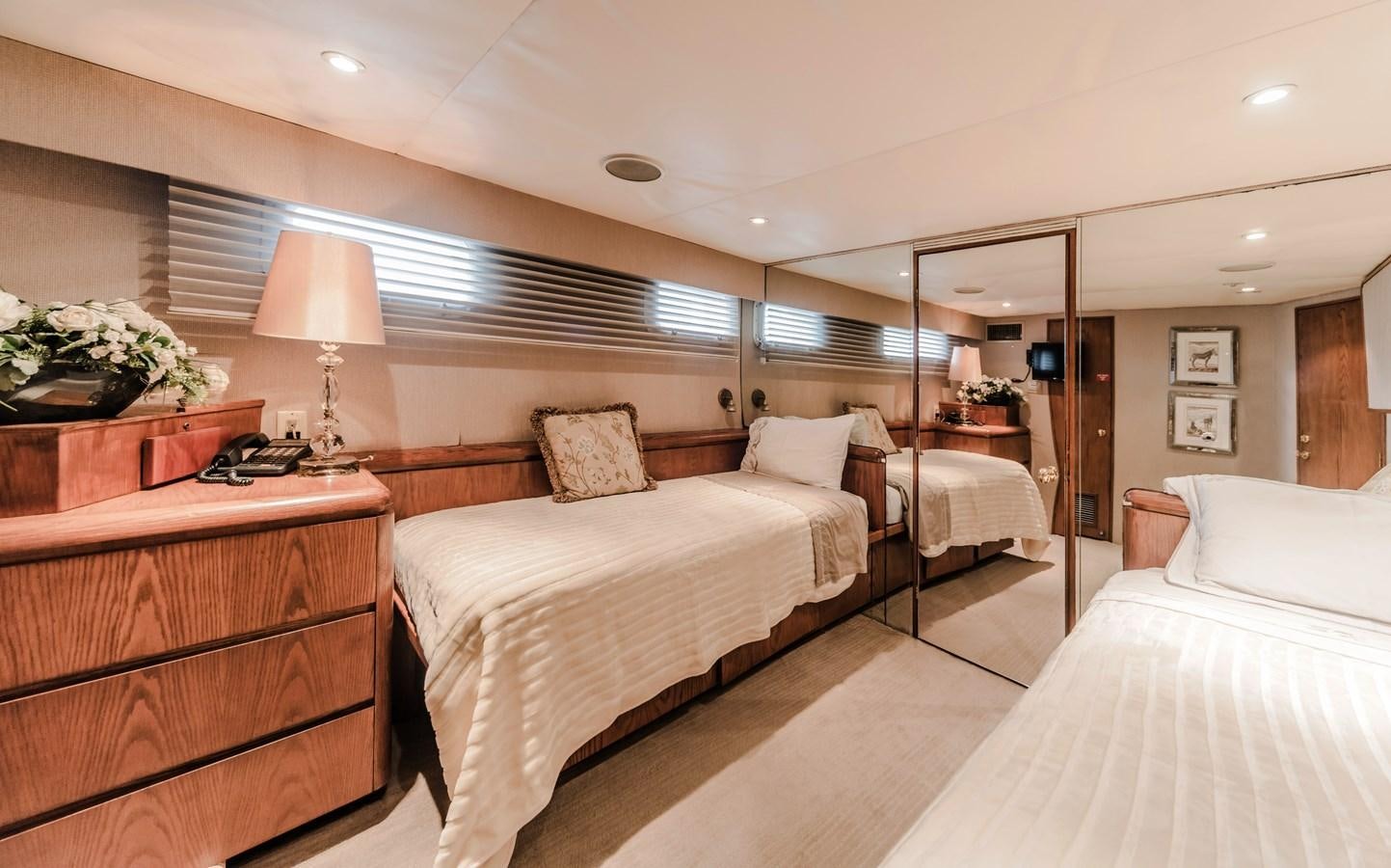 a bedroom with a bed and a desk aboard SU Yacht for Sale