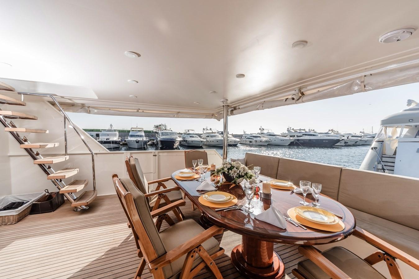 a table with plates and food on it aboard SU Yacht for Sale
