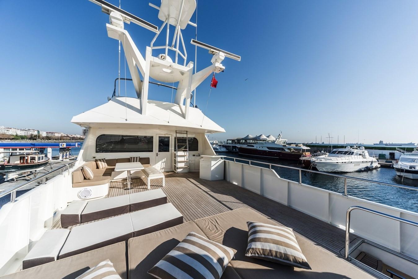 a boat docked at a pier aboard SU Yacht for Sale