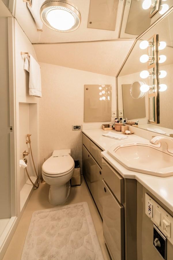 a bathroom with a toilet and a sink aboard SU Yacht for Sale