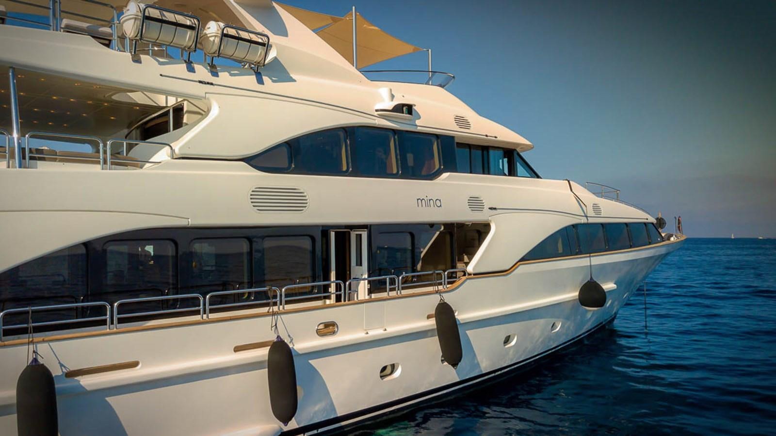 a white yacht on the water aboard MINA Yacht for Sale