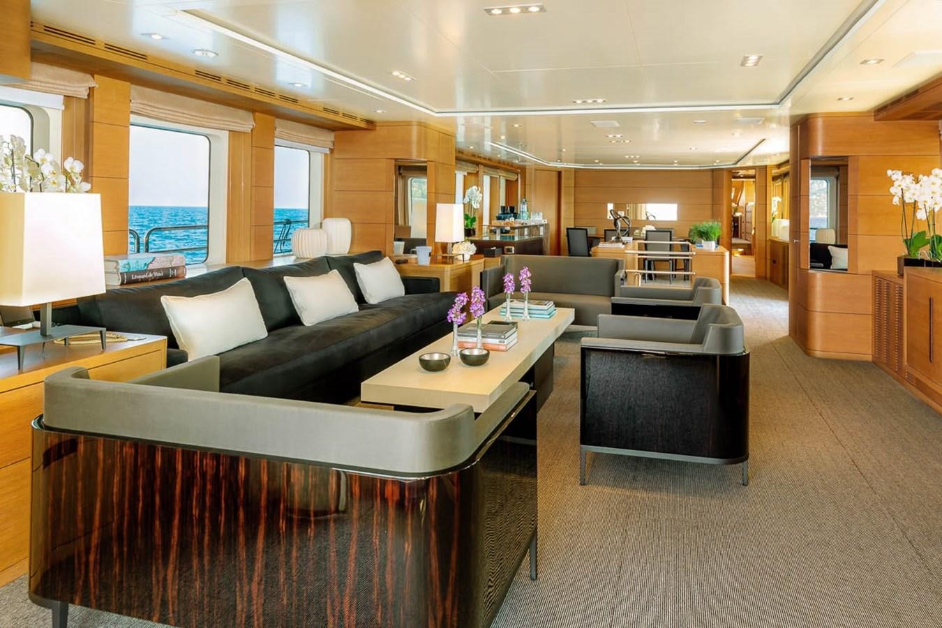 a living room with a couch and a coffee table aboard MINA Yacht for Sale