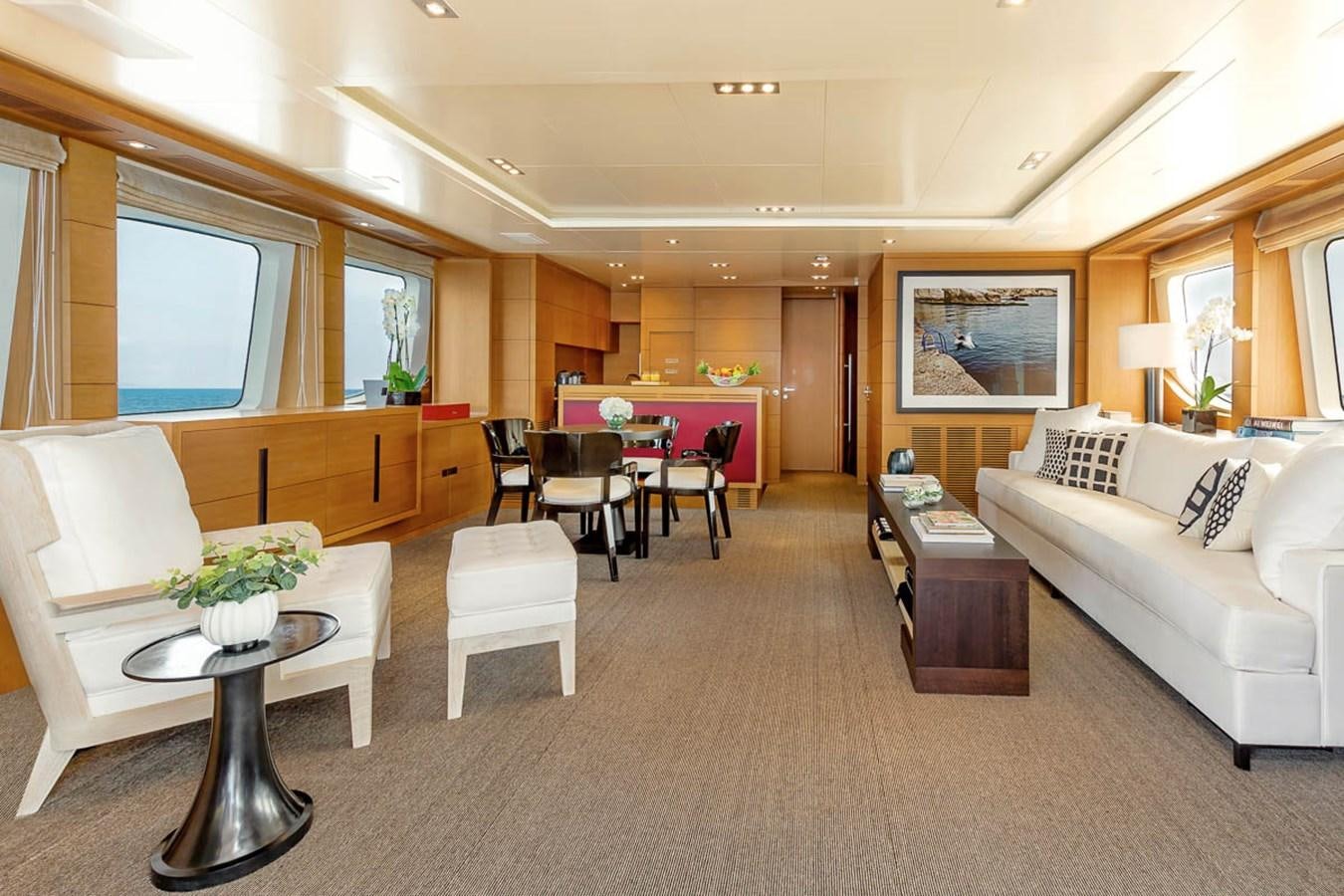 a living room with a couch and a table aboard MINA Yacht for Sale