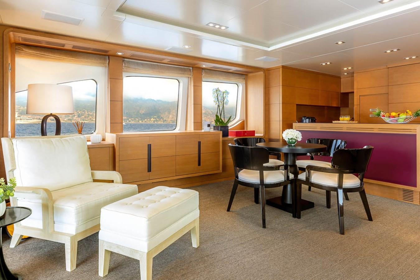 a room with a table and chairs aboard MINA Yacht for Sale