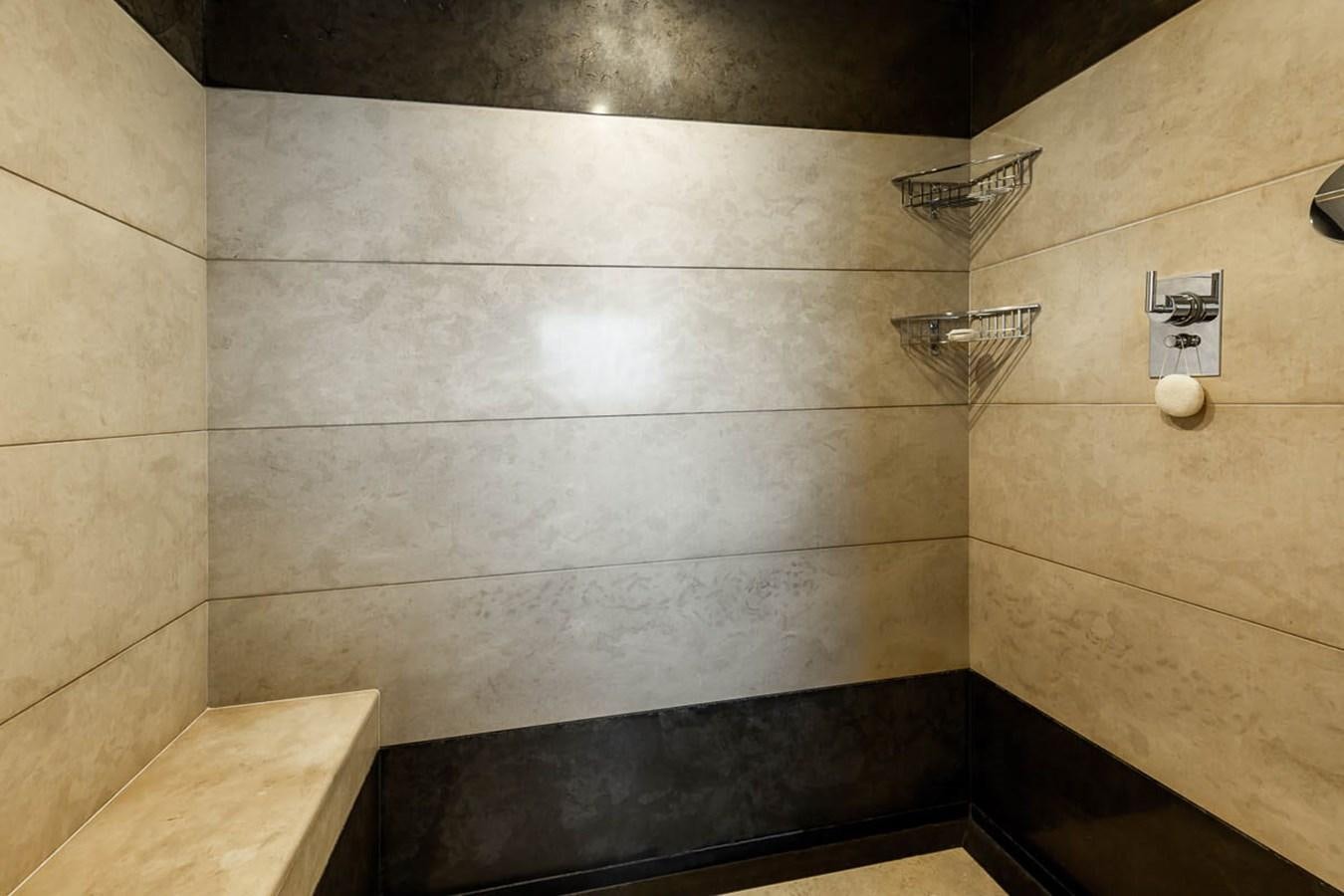 a tile floor with a wire basket aboard MINA Yacht for Sale