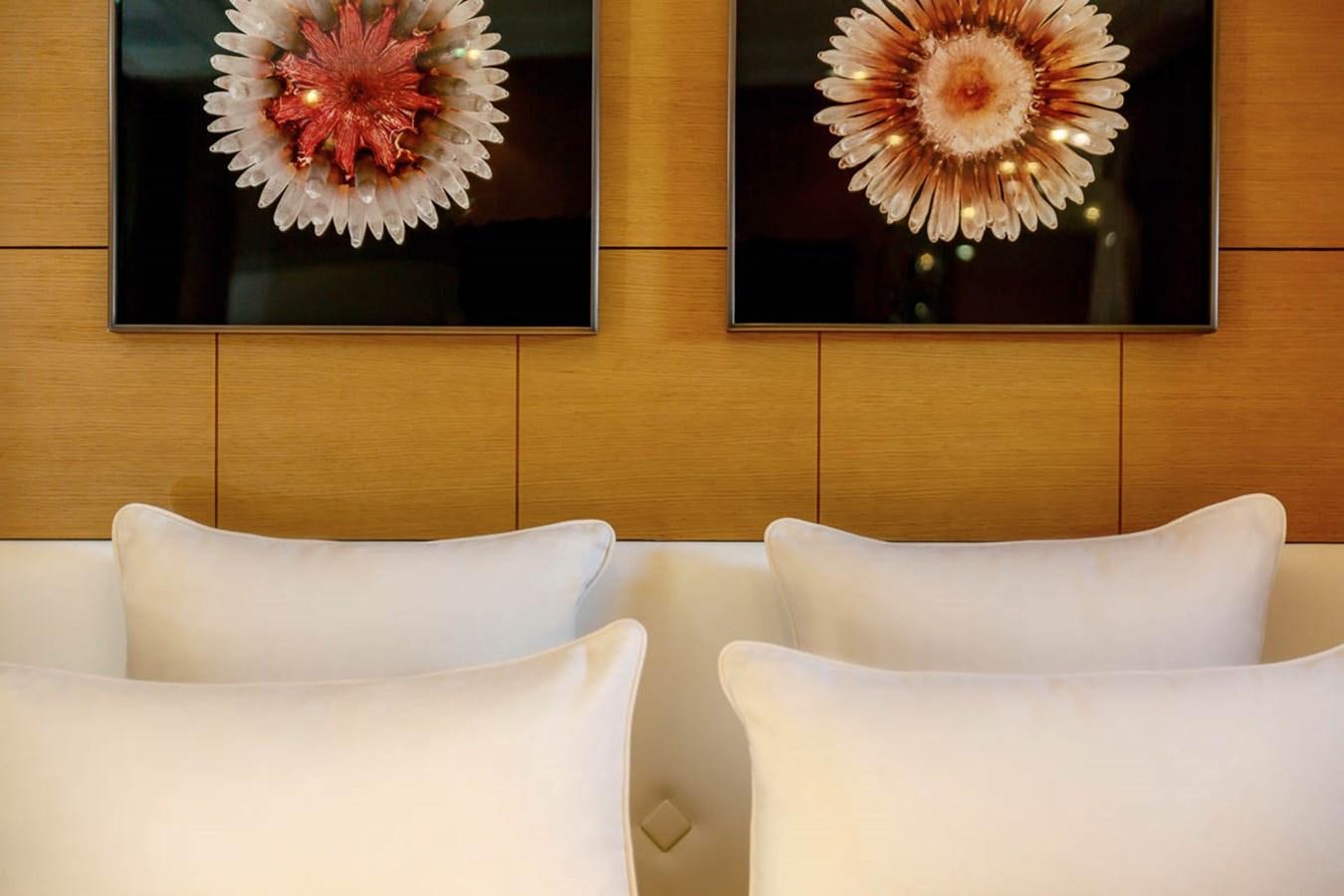 a room with couches and a flower on the wall aboard MINA Yacht for Sale