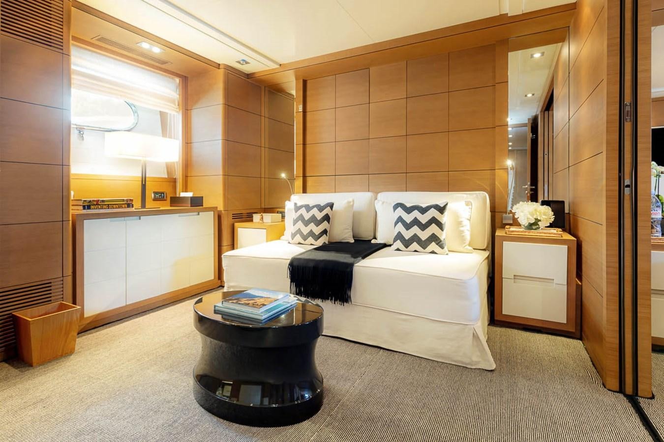 a room with a bed and a table aboard MINA Yacht for Sale