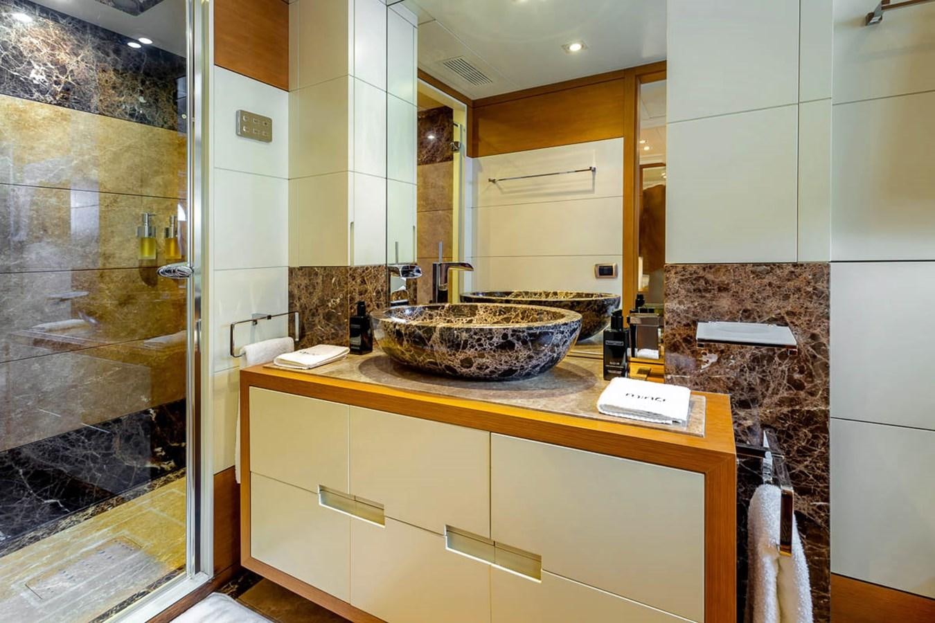 a bathroom with a sink and a mirror aboard MINA Yacht for Sale